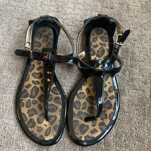 sperry black cheetah sole sandals with gold detail